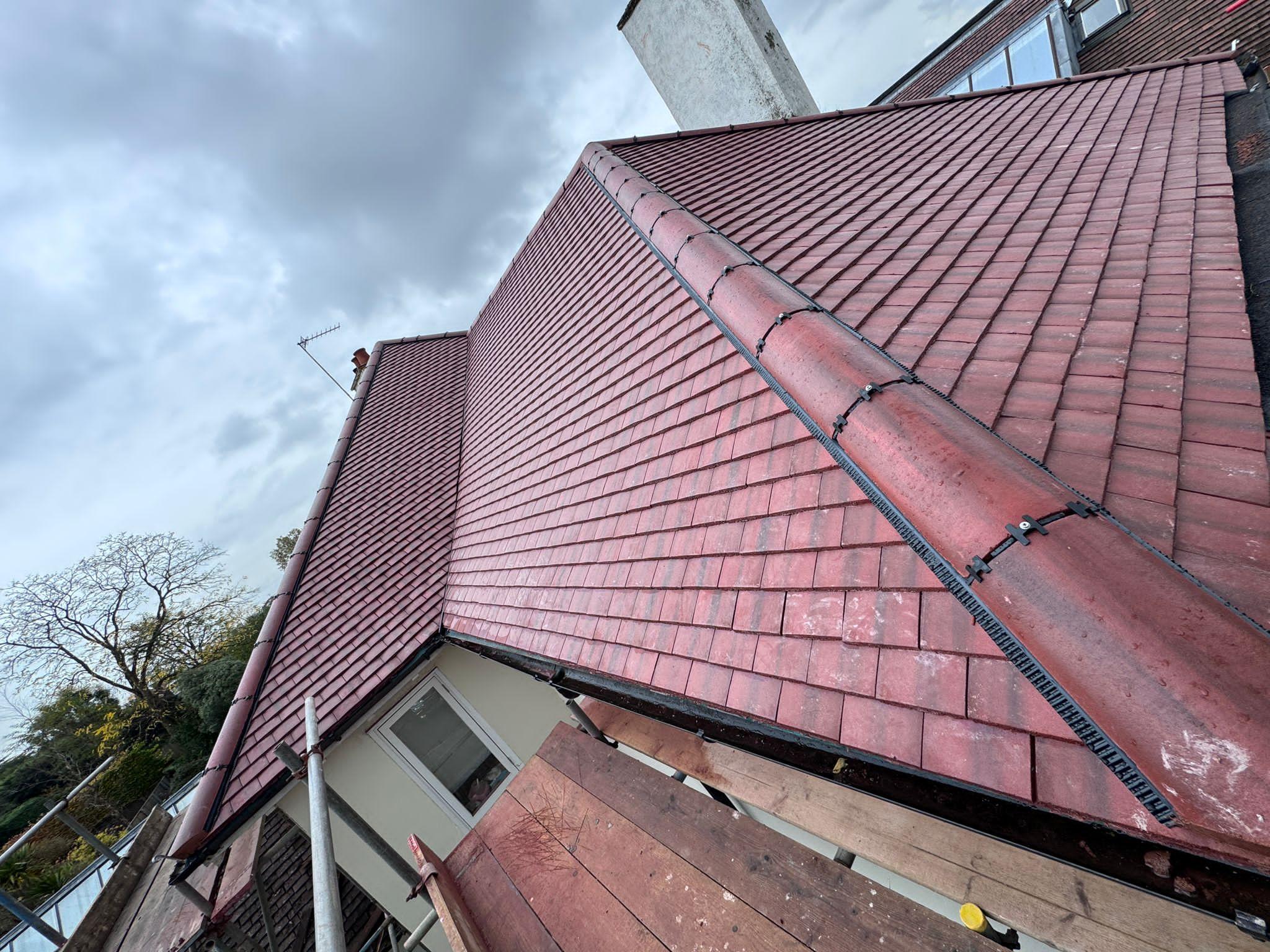 Chimney stack with new slate roof repair and lead flashing renewal by ATS Roofing
