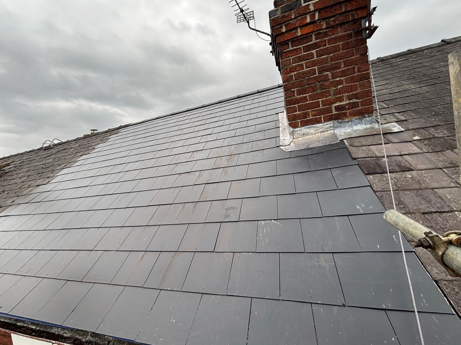 Completed roofing project with skylight integration in Ipswich